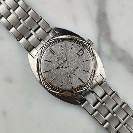 Omega Constellation C-Shape Ref. 168.027 (1968) – Seltene Linen-Dial-Ausführung mit 18-karätiger Weißgoldlünette und Original-Rivet-Armband